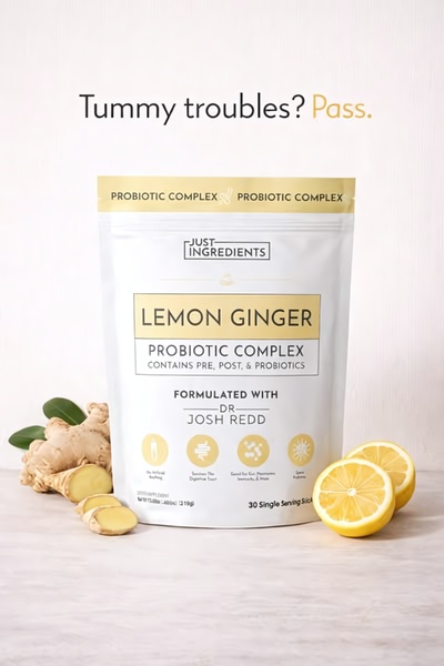 A clean, studio-lit product shot of a Lemon Ginger Probiotic Complex pouch surrounded by raw ingredients to signal natural health benefits.